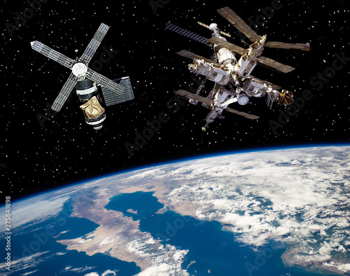 Two space stations above the earth. The elements of this image furnished by NASA. © wowinside