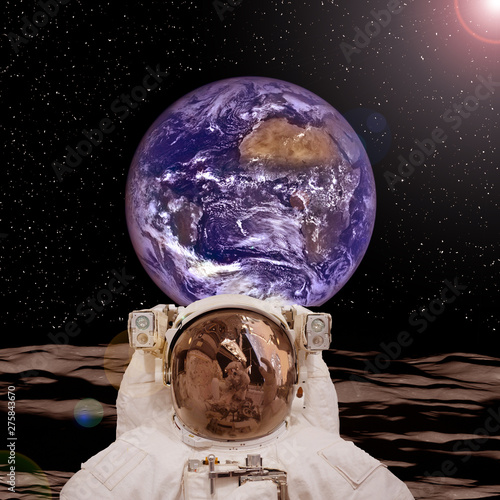 Astronaut posing on the moon. The elements of this image furnished by NASA. photo