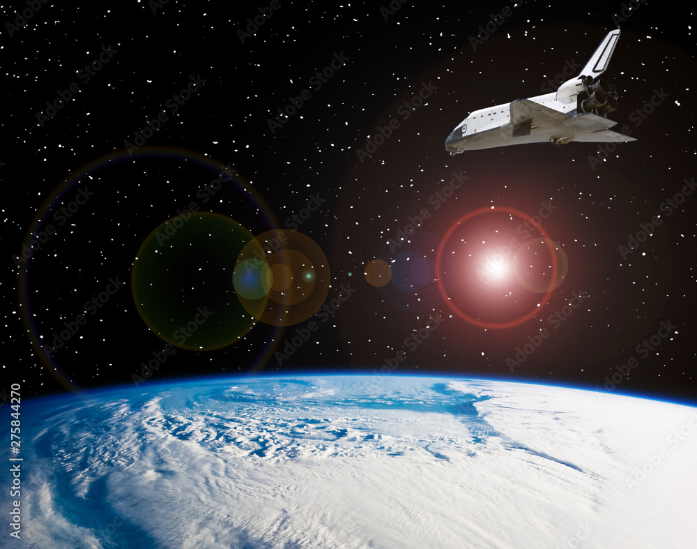 Shuttle that flies in space. The elements of this image furnished by NASA. Shuttle that flies in space. The elements of this image furnished by NASA.