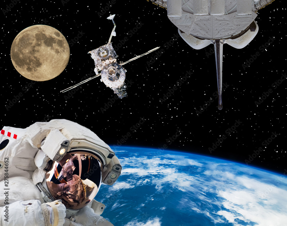 Fototapeta premium Astronaut in outer space, moon and spaceships on the backdrop. The elements of this image furnished by NASA.