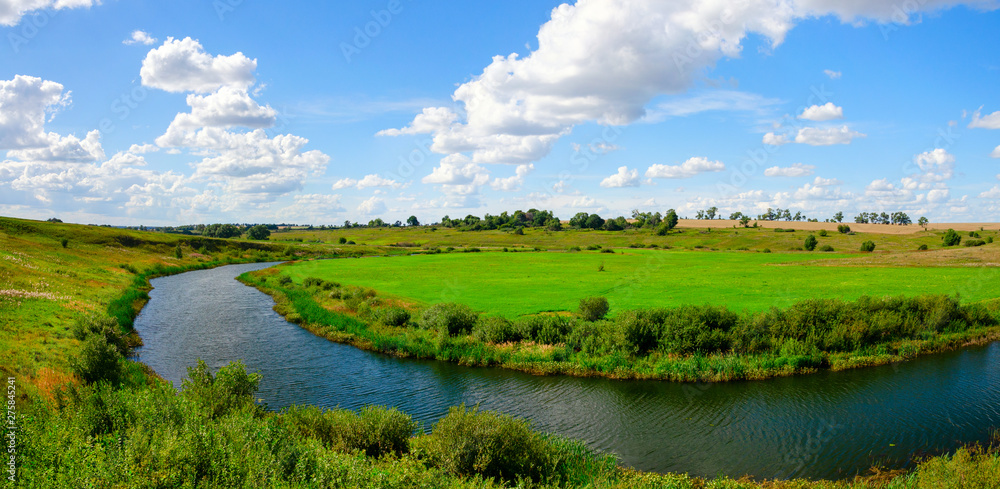 Sunny summer landscape with river and fields