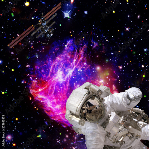 Astronaut flies in space. The elements of this image furnished by NASA.