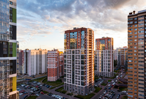 view of modern multistorey buildings in St. Petersburg at sunset against the sky