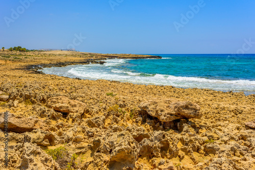  pristine seascapes with crystal clear blue water and yellow rocks in Ayia Napa  Cyprus