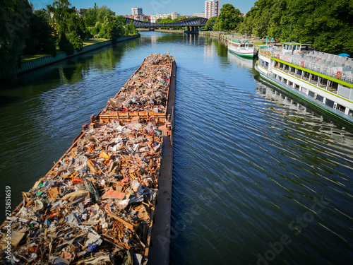 Scrap metal on a barge on a river in Germany