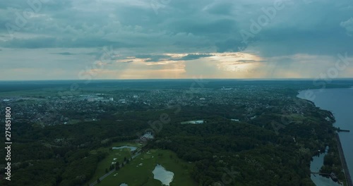 drone hyperlapse: spectacular and very colorful sunset over the golf course in the private residence of Mezhyhiria and the small village of New Petrovtsy .Kyiv, Ukraine  - Cityscape Aerial Flight photo