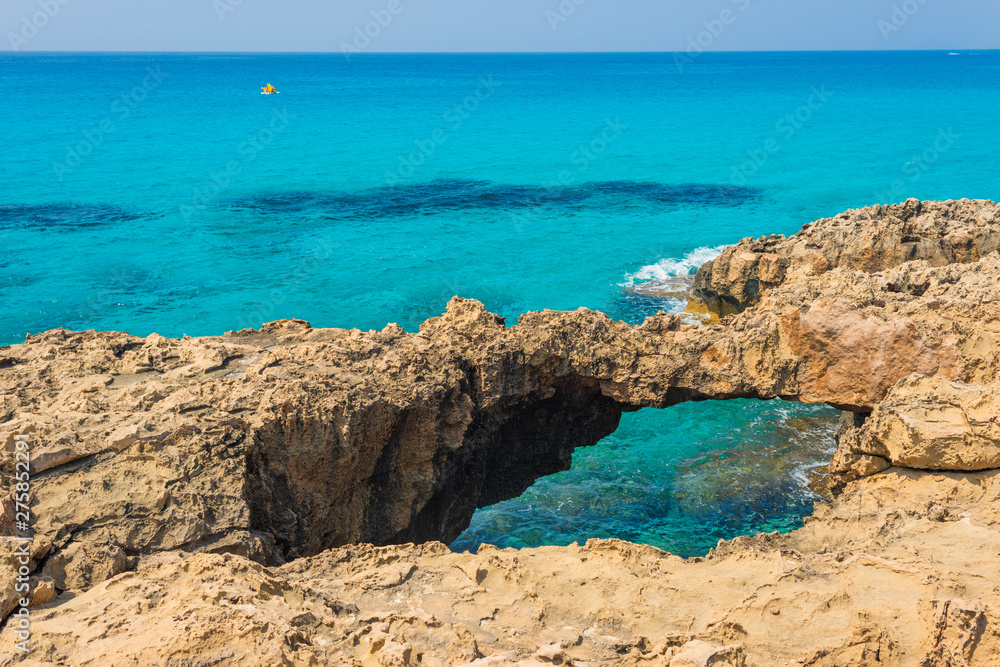 pristine seascapes with crystal clear blue water and yellow rocks in Ayia Napa, Cyprus