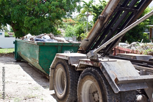  Debris from residential  construction site collected in roll off dumpster for efficient disposal