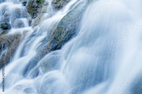 Close of tropical waterfall pouring on limestone.