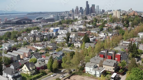 Tilt Up Aerial View Of Seattle Usa Downtown From Suburbia With City Road Traffic and Skyscrapers photo