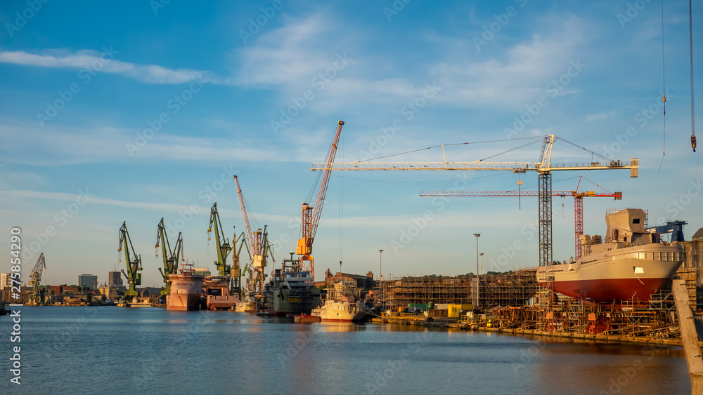 View of the shipyard with historical cranes and ships in the industrial part of the city Gdansk/Poland.