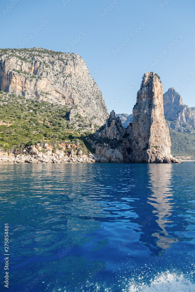 The monolith of Pedra Longa, Baunei, province of Ogliastra, East Sardinia, Italy. The rocky spire which rises majestically out of the sea. Holidays in Sardinia.