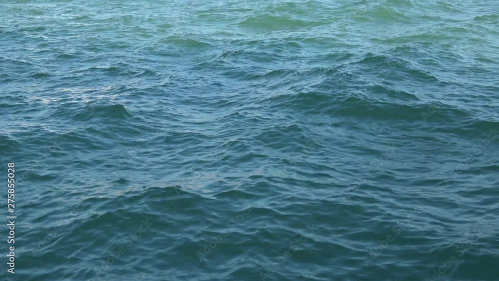 View motion dark blue waves on water. Abstract background View motion dark blue waves on water. Abstract background