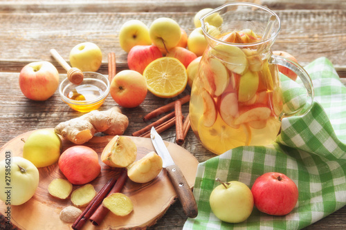 ingredients for refreshing drink, apples, ginger, lemon, honey, spices