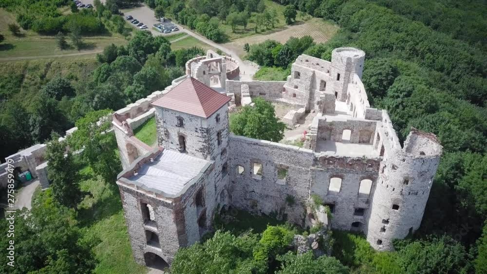 Beautiful historic castle ruins on a green hill. Ruins of Tenczyn Castle in Rudno, Poland. Beautiful historic castle ruins on a green hill. Ruins of Tenczyn Castle in Rudno, Poland.