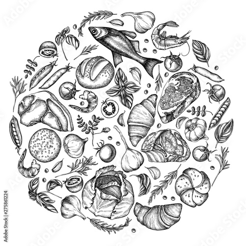 Round floral design with black and white garlic, cherry tomatoes, peas, fish, shrimp, cabbage, beef, buns and bread, croissants and bread, basil, rosemary