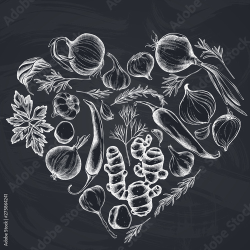 Heart floral design with chalk onion, garlic, pepper, greenery, ginger, basil, rosemary