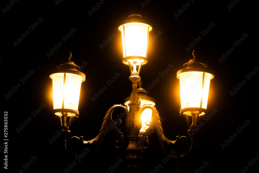 black iron street lamp at night