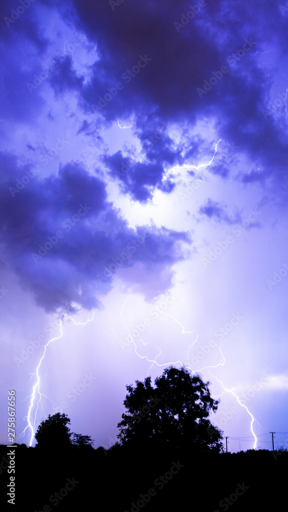 Lightning flashes over the night sky during thunderstorm. Lightning flashes over the night sky during thunderstorm.