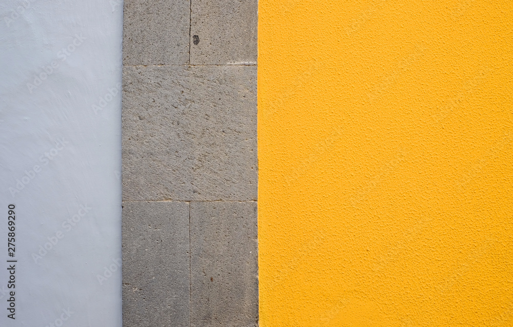 Fototapeta premium Wall panels in gray and yellow colors, detail of modern house finish.