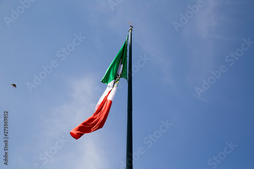 Flag of Mexico over blue sky photo