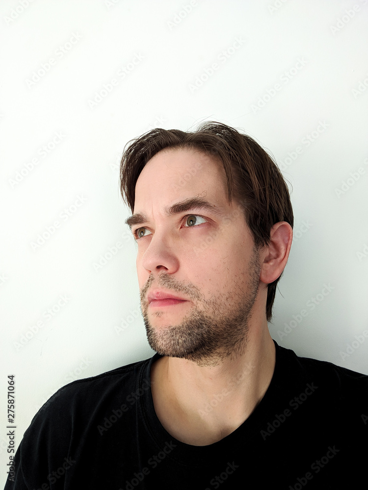 Portrait of Ambivalent Young Man Isolated on White Background Portrait of Ambivalent Young Man Isolated on White Background