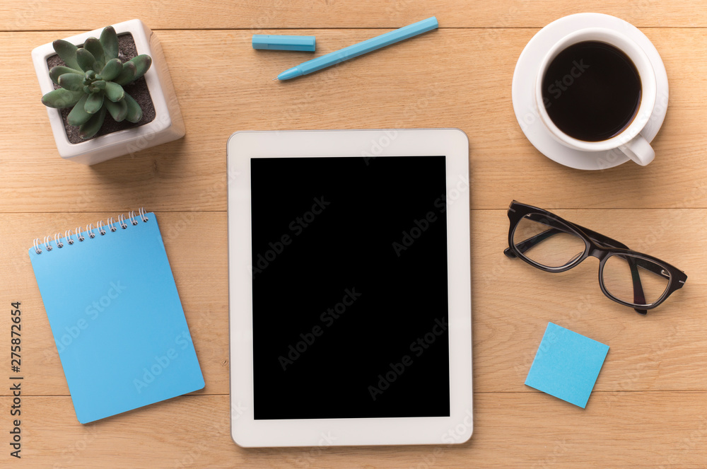 Tablet with black blank screen on office table Tablet with black blank screen on office table