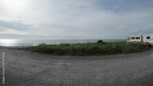 Time lapse - View of Cook Inlet, Mr Redoubt, and Campground at Deep Creek Recreational Area in Alaska