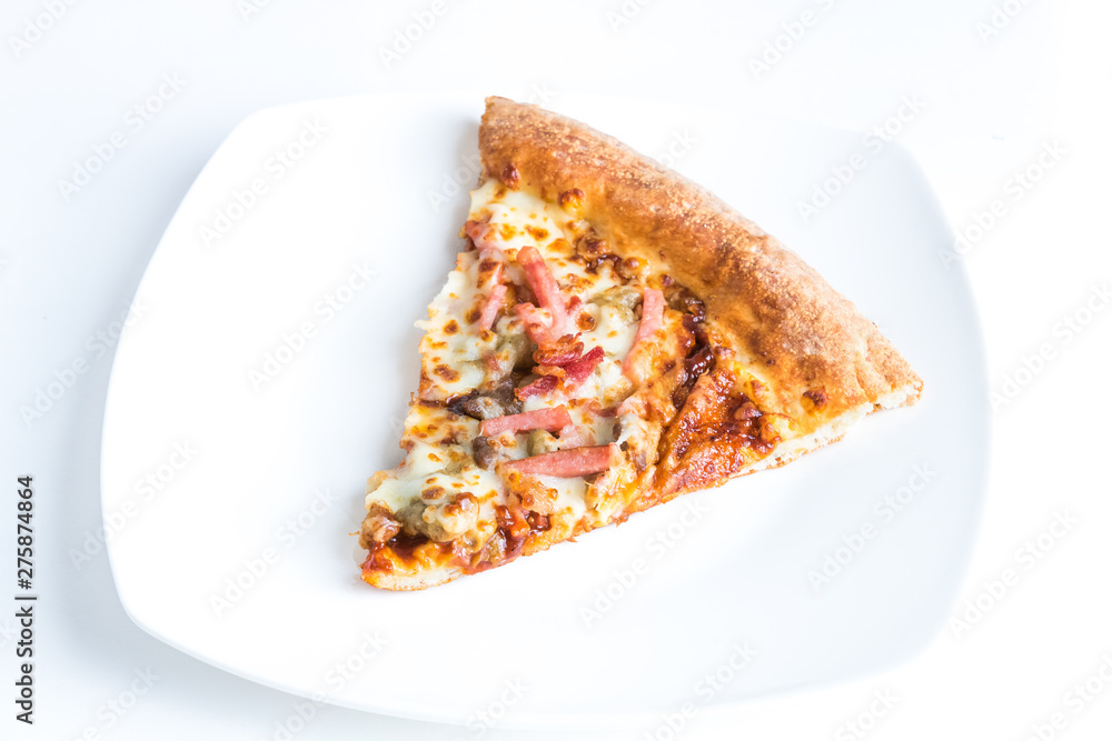 Slice of barbeque meat pizza on a plate.
