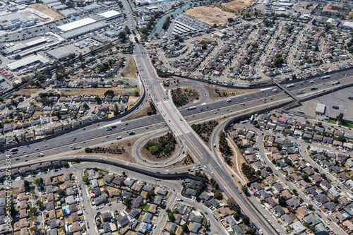 Aerial view of streets, buildings and traffic along the 880 freeway at 98the Ave in Oakland California.