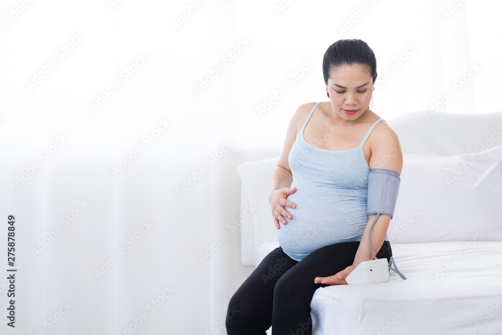 Pregnant woman with pressure gauge. Pregnant woman with pressure gauge.