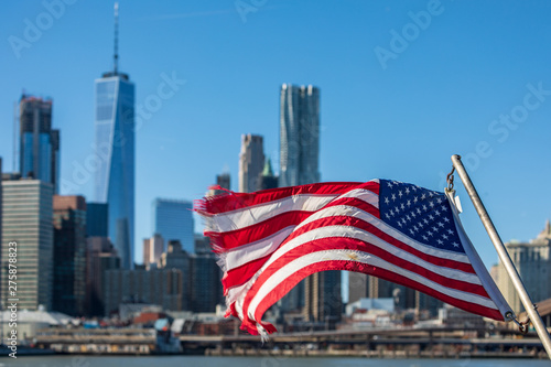new york city skyline and american flag