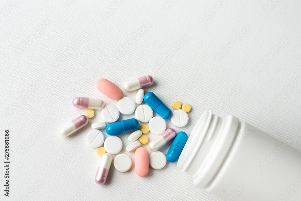 medicines pills vitamins pills health macro on white background, isolated. Copy space for text medicines pills vitamins pills health macro on white background, isolated. Copy space for text