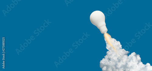 Ideas inspiration concepts with rocket lightbulb on blue background.Business start up or goal to success