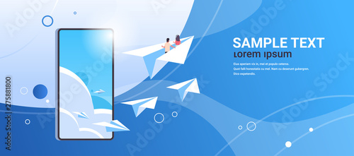 couple in love flying on paper airplane man woman lovers traveling together romantic concept smartphone screen online mobile app flat horizontal copy space