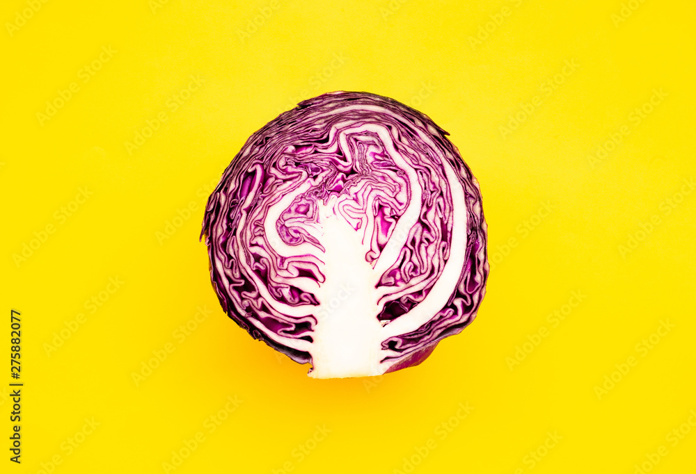 Fototapeta premium Fresh of purple cabbage (half sliced)on color background