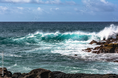 Waves at Keoniloa Bay, Kauai, Hawaii photo