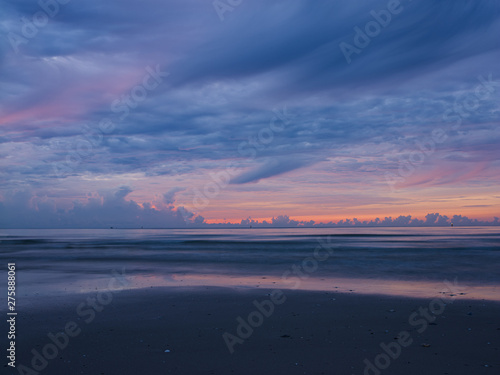 sunset on the beach at hua-hin thailand