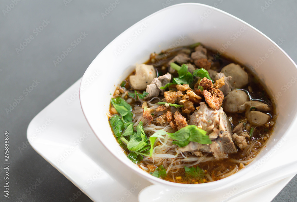Rice noodle soup with Cooked Liver in bowl on table, selective focus Rice noodle soup with Cooked Liver in bowl on table, selective focus