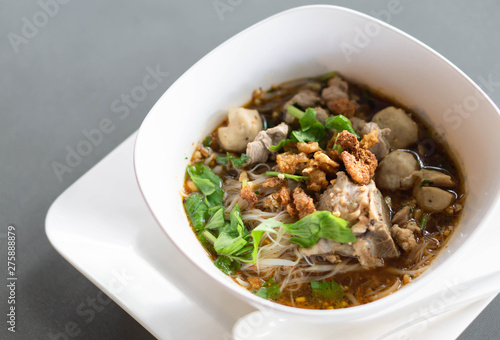 Rice noodle soup with Cooked Liver in bowl on table, selective focus