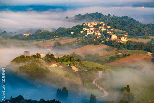 Beautiful foggy morning in Umbria countryside photo