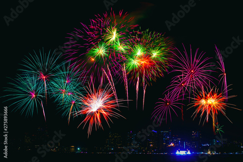 Beautiful colorful fireworks display on the sea beach, Amazing holiday fireworks party or any celebration event in the dark sky.