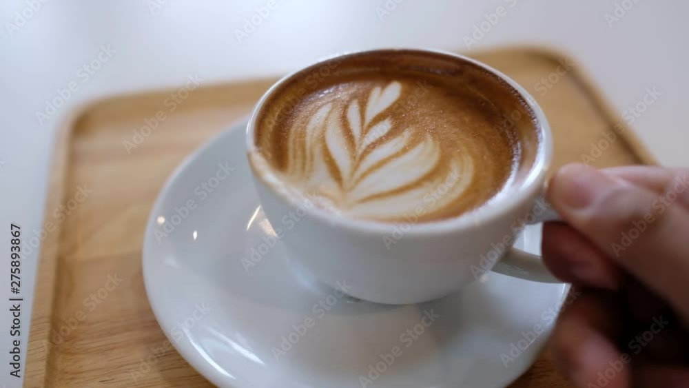 hot latte art coffee on wood table, relax time hot latte art coffee on wood table, relax time