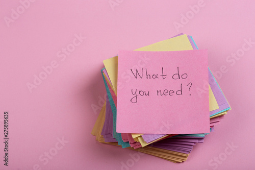 Help and advice concept - sticky note with text What do you need photo