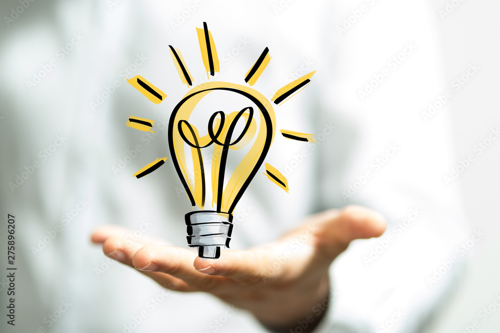 holding illuminated light bulb, idea, innovation and inspiration concept. holding illuminated light bulb, idea, innovation and inspiration concept.