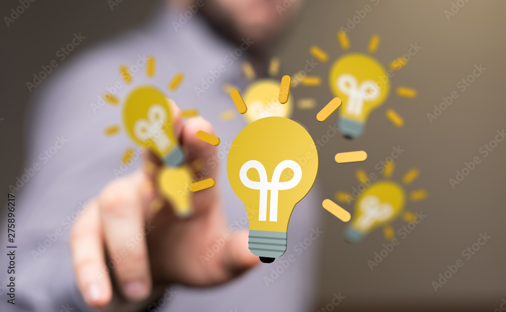 holding illuminated light bulb, idea, innovation and inspiration concept. holding illuminated light bulb, idea, innovation and inspiration concept.