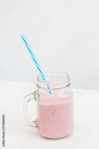 glass of milkshake on white background