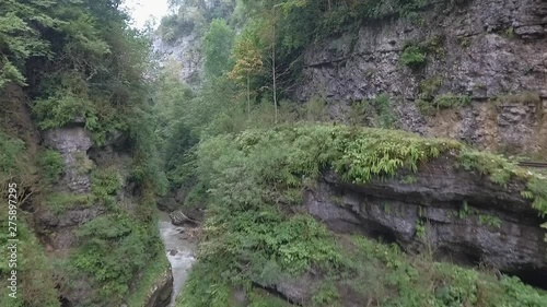 Rocky walls of a deep gorge photo