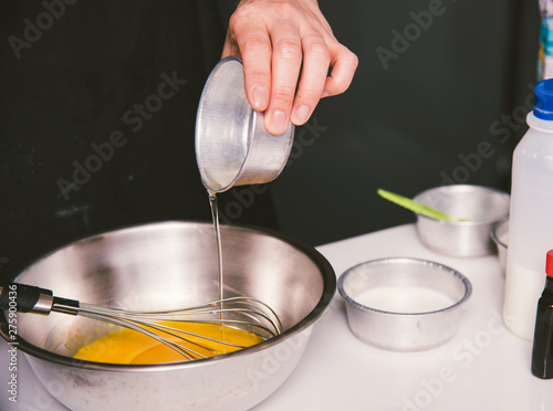Woman during making pouring oil