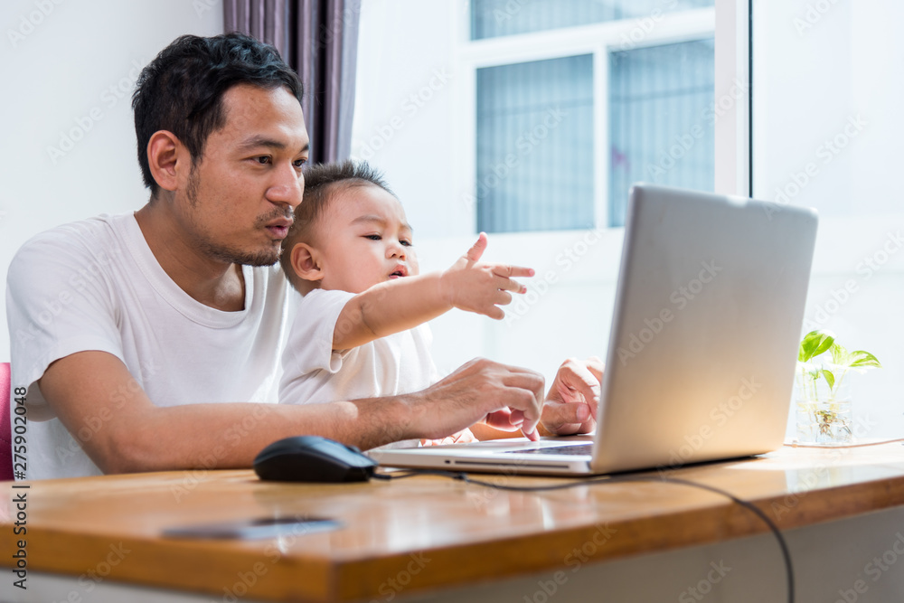 Man father using working on laptop computer Man father using working on laptop computer